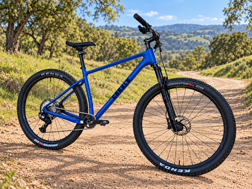 Gloss blue Cobalt Diablo hardtail mountain bike on a sunlit dirt trail