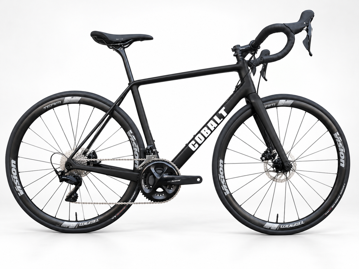 Cobalt Spitfire matte black carbon road bike with white Cobalt graphics on a white studio background