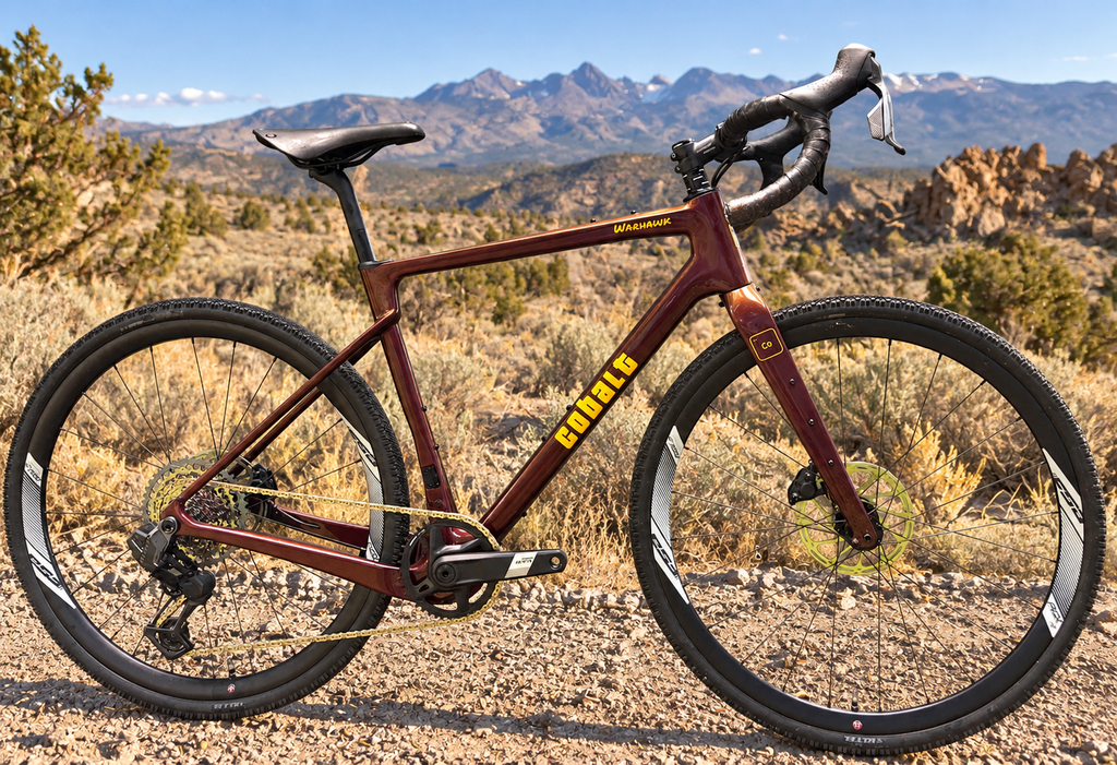 Cobalt Warhawk gravel bike in burgundy and gold on a high desert trail